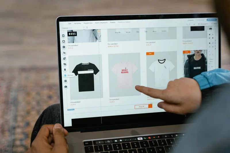 Two people browsing an online marketplace on a laptop representing UAE ecommerce buyer experience